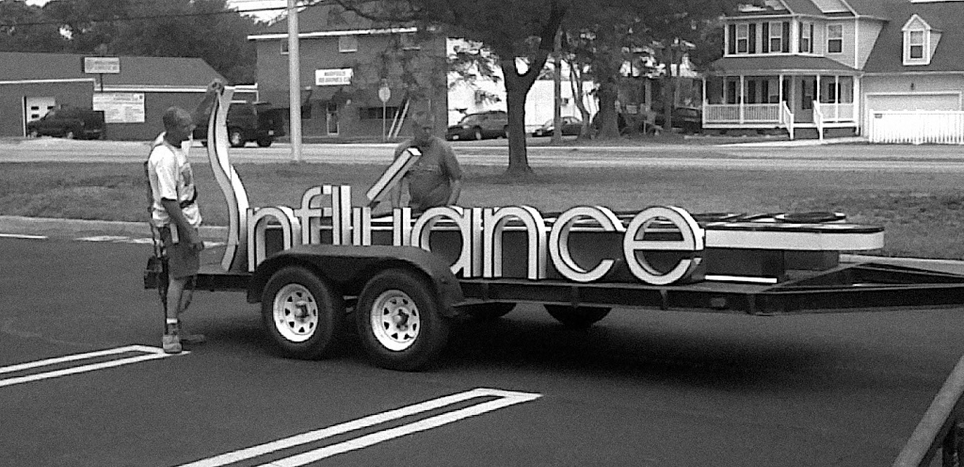 Influance building sign on a trailer